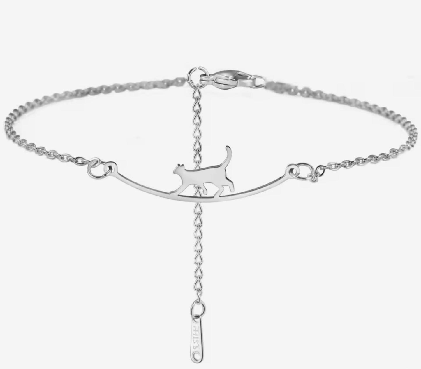 silver anklet with a cat crossing a tightrope