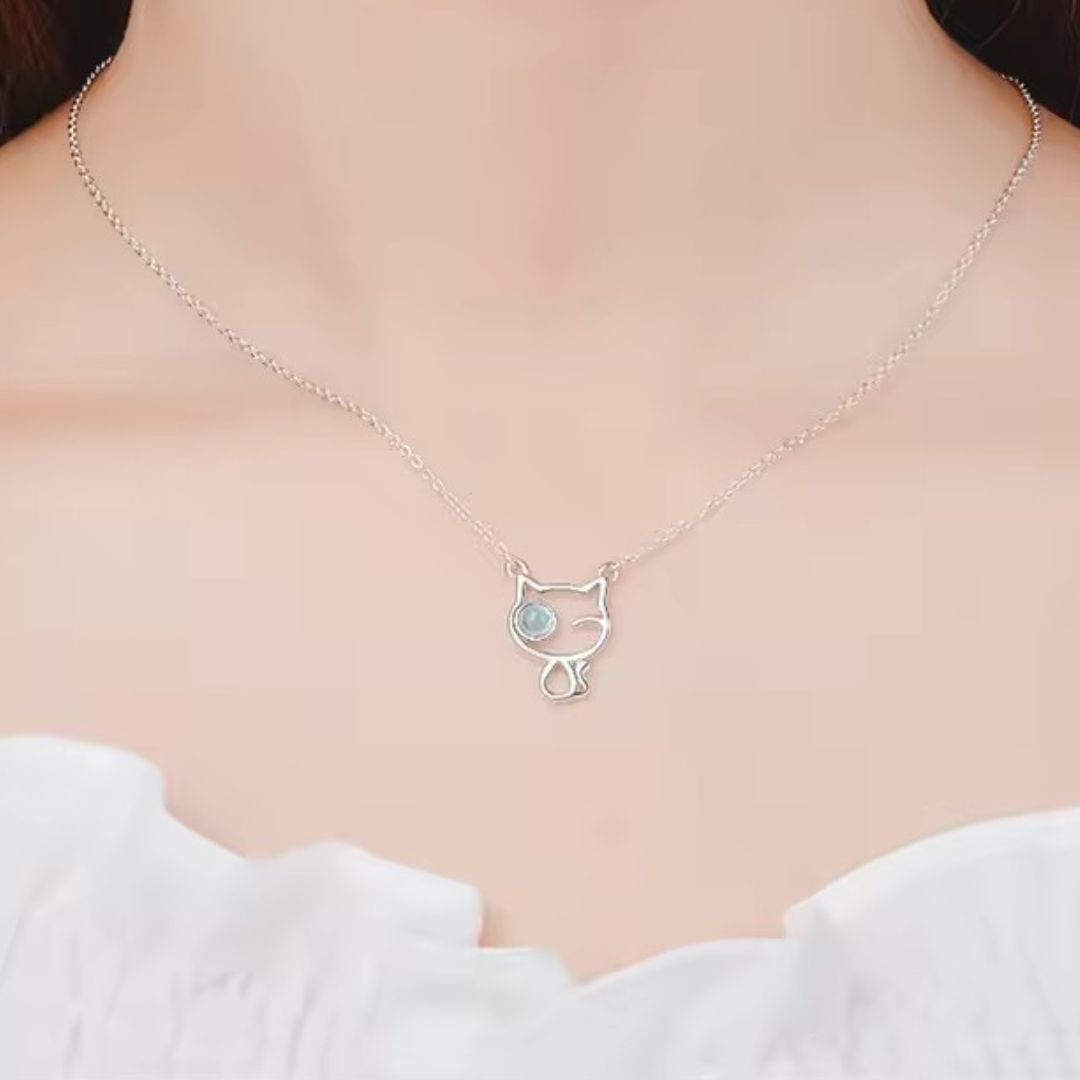 Sterling silver cat necklace with a winking blue eyeball on a delicate silver chain