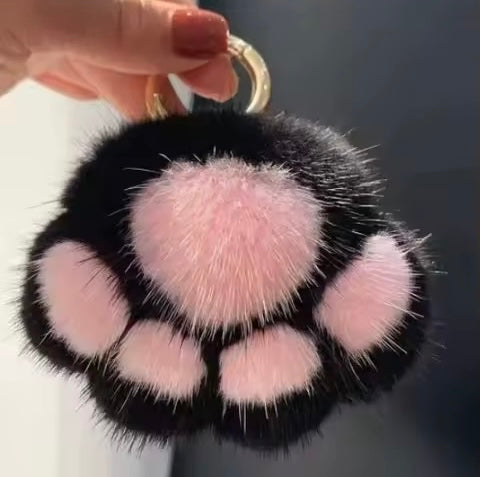 black fluffy paw shaped Pom Pom purse charm with gold hardware