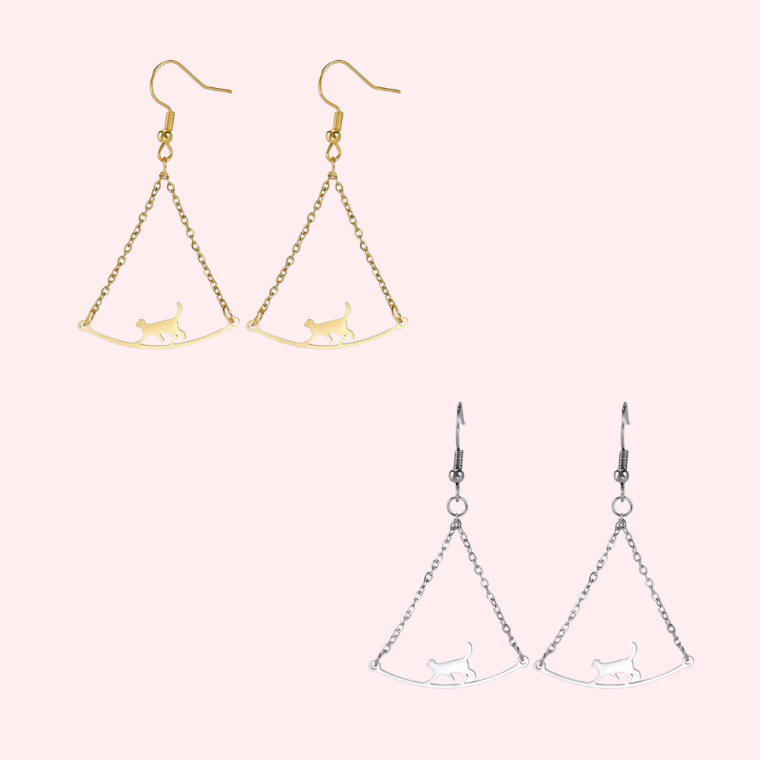 Stainless steel cat earrings dangle from a delicate chain on a French wire 