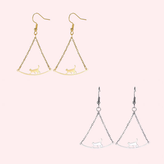 Stainless steel cat earrings dangle from a delicate chain on a French wire 